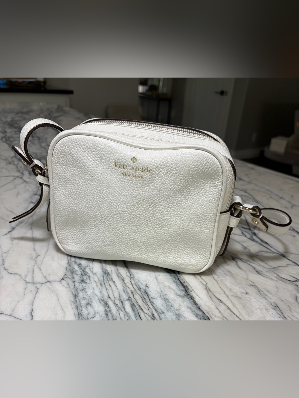 Kate Spade white pebbled leather crossbody with gold logo